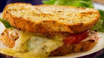 Toasted Cheese and Ham Sandwich, Italian style with tomato and basil