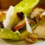 Tangy Ceasar Salad with home made dressing, grilled chicken and crispy bacon