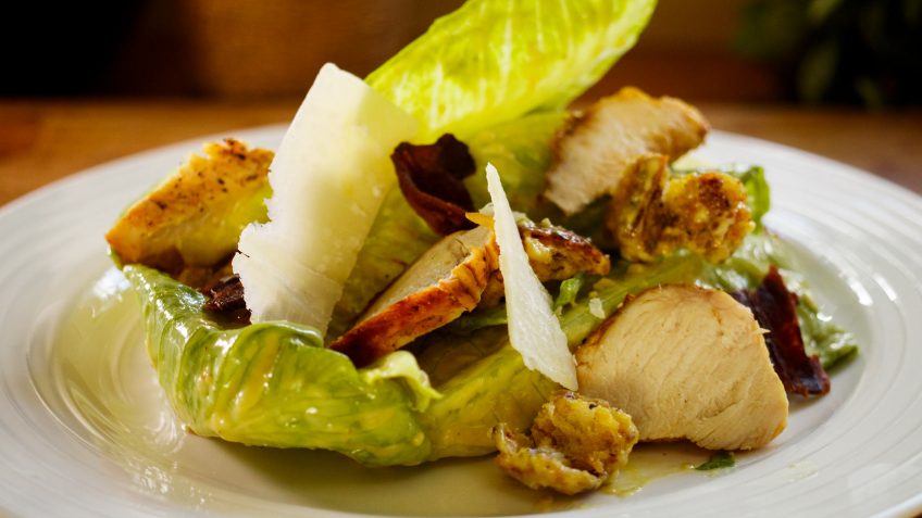 Tangy Ceasar Salad with home made dressing, grilled chicken and crispy bacon