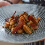 Hand rolled potato gnocchi with prosciutto and red onion jam